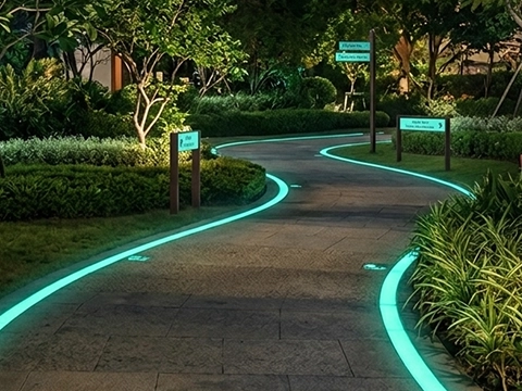 Glow-in-the-dark park walkway path lit at night